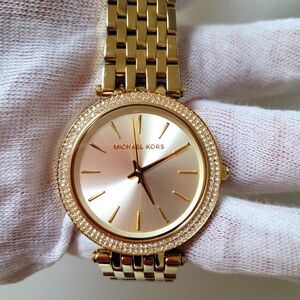 Michael Kors Goldtone Darci watch, 39mm case, 12mm band width.